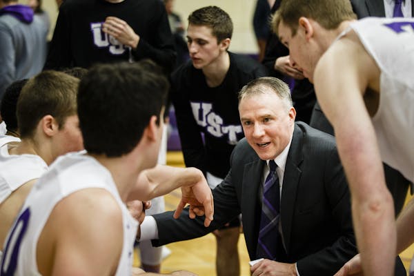 Head coach John Tauer talks to players during a time out at the men's basketball MIAC Championship game versus St. Olaf College February 28, 2016 in t