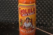 This Tuesday Nov. 24, 2020 photo shows a bottle of Cholula Hot Sauce. Spice maker McCormick & Co. is buying the parent of Cholula Hot Sauce from priva