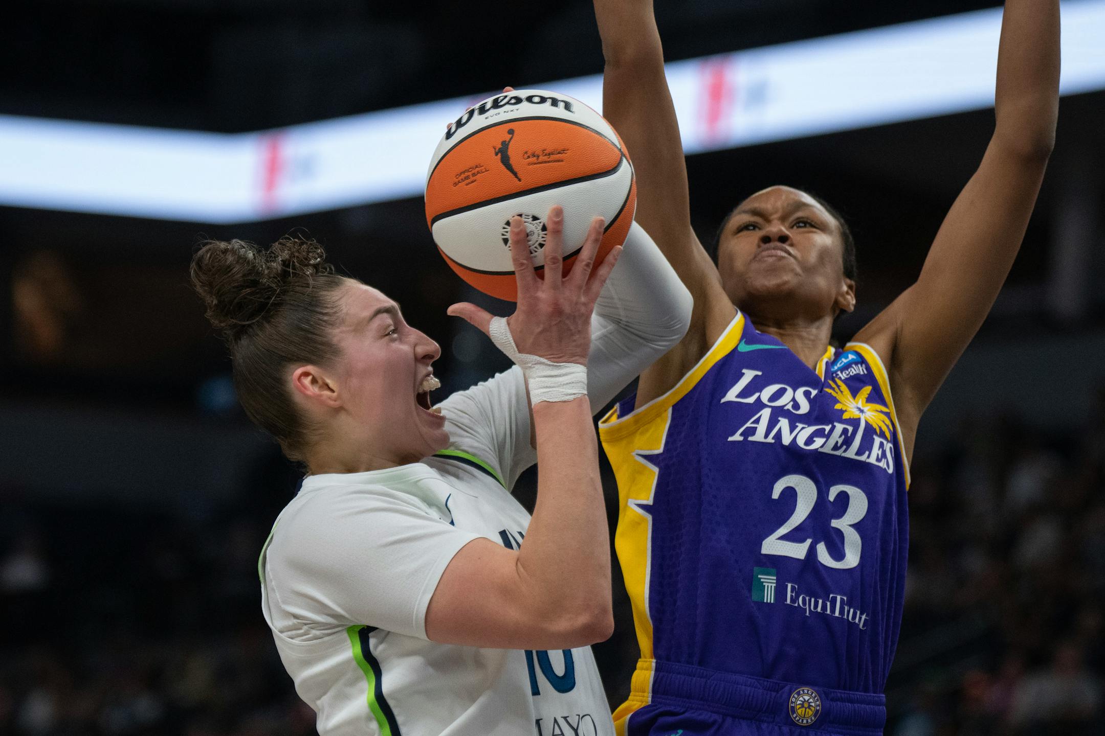 Minnesota Lynx forward Jessica Shepard (10) drove to the basket on Los Angeles Sparks forward Azura Stevens (23) in the first half.
