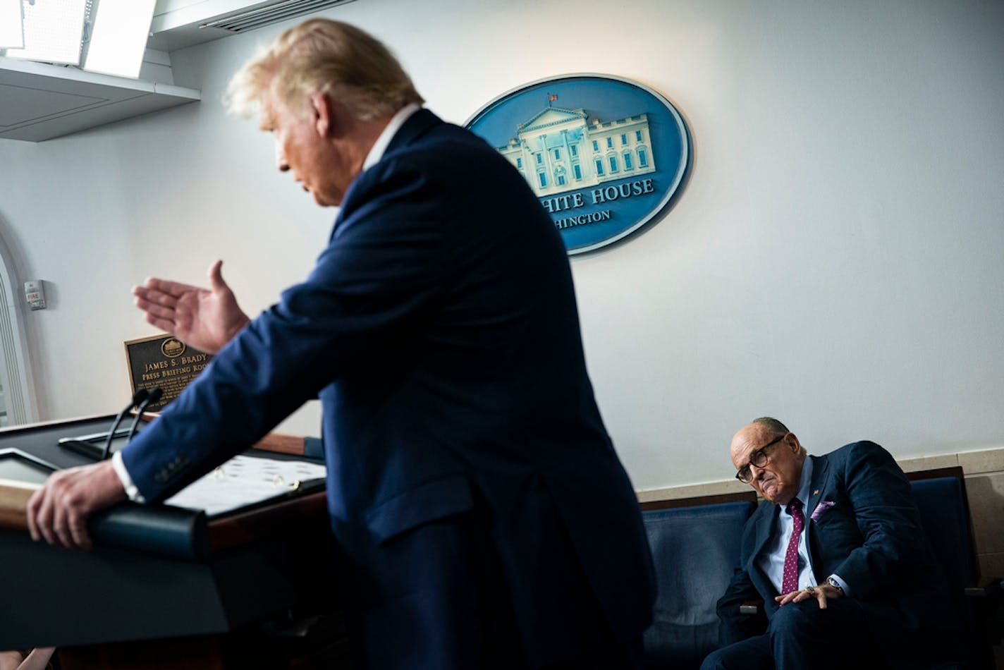 FILE — Rudy Giuliani, then President Donald Trump's personal lawyer, listens as Trump speaks during a news briefing in the White House in Washington, Sept. 27, 2020. New accounts show that Trump was more directly involved than previously known in exploring proposals to use his national security agencies to seize voting machines as he grasped unsuccessfully for evidence of fraud that would help him reverse his defeat in the 2020 election, according to people familiar with the episodes. (Al Drago/The New York Times)