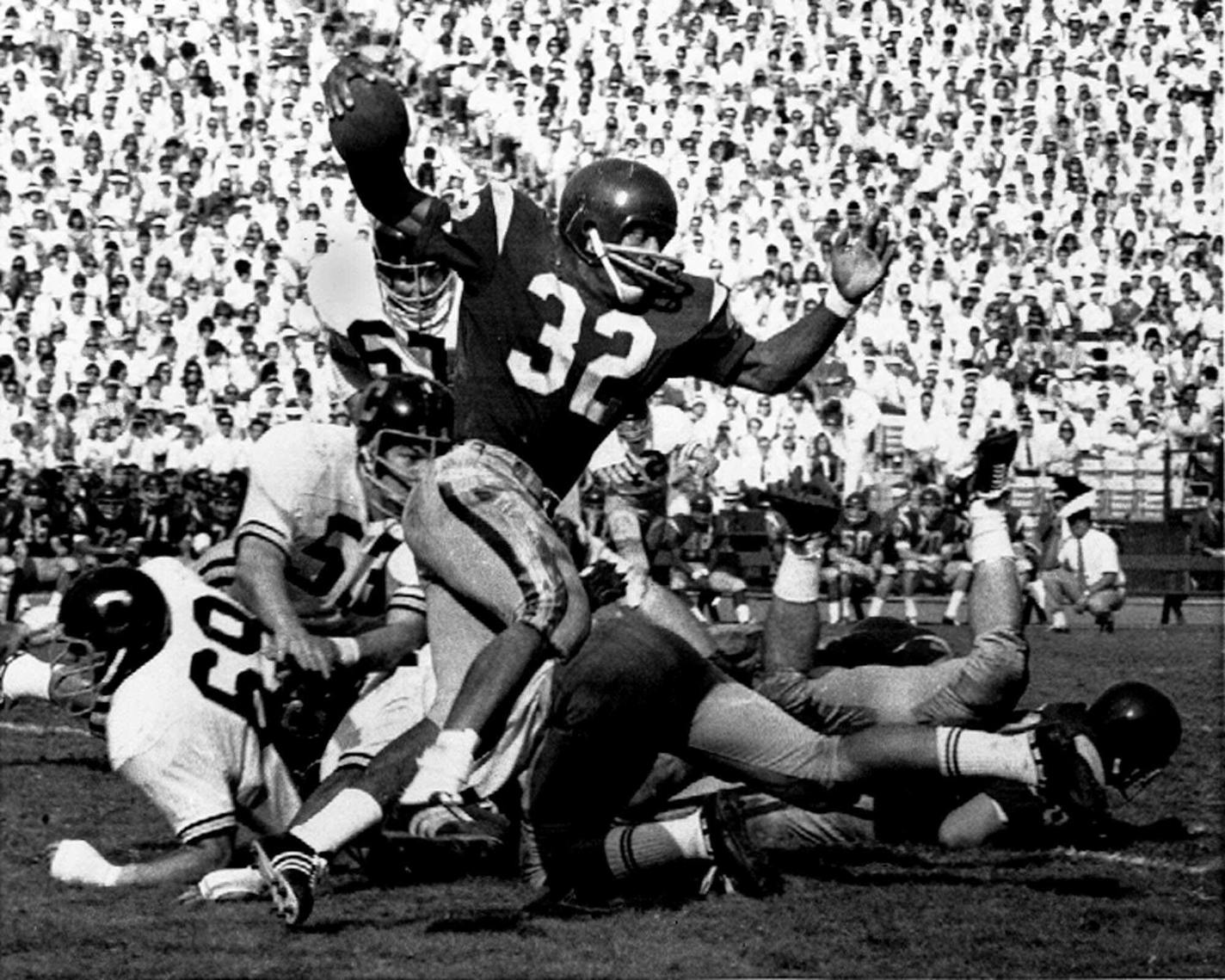 Southern California's O.J. Simpson tries to break a California tackle as he picks up five yards in Los Angeles Memorial Coliseum Nov. 9, 1968.