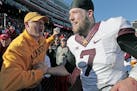 Minnesota's quarterback Mitch Leidner (7) was greeted by fans as he celebrated the Gophers 28-24 win over Nebraska at Memorial Stadium, Saturday, Nove