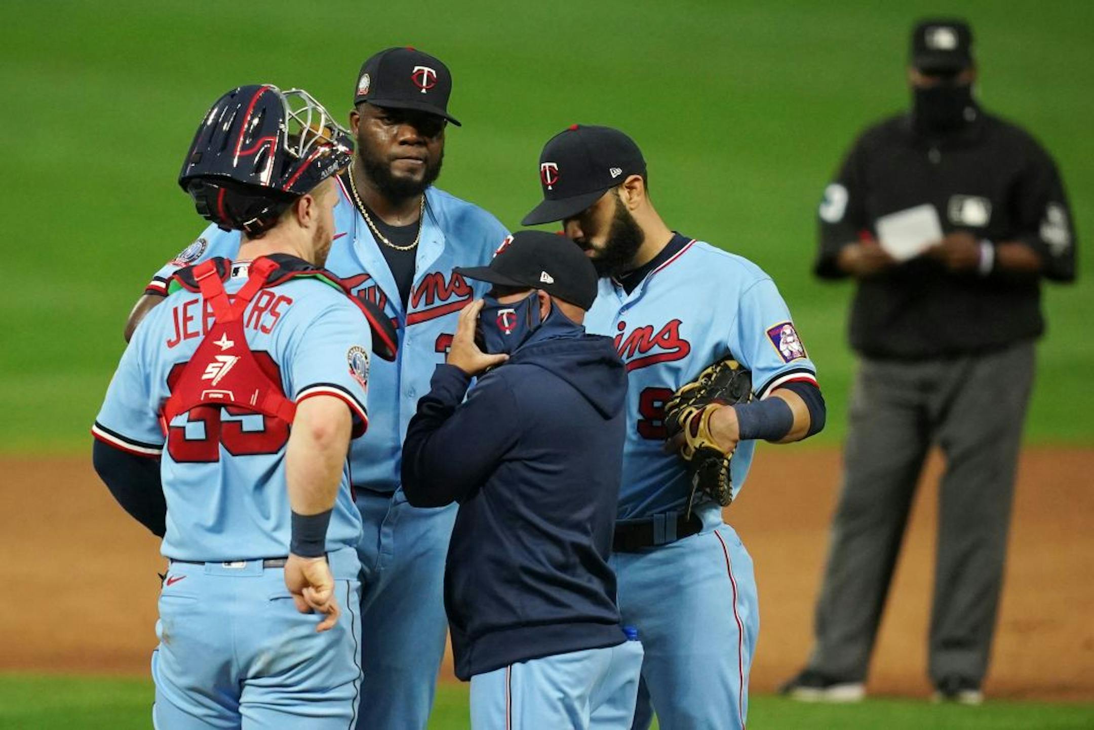 Minnesota Twins starting pitcher Michael Pineda (35) got a visit on the mound from pitching coach Wes Johnson (47) after giving up a run in the first inning.