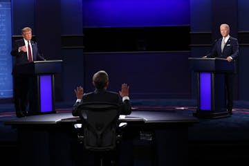 Then-President Donald Trump, left, and then-Democratic presidential nominee Joe Biden, right, participate in a presidential debate in 2020 in Clevelan