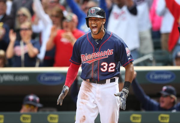 Aaron Hicks celebrated Torii Hunter�s double scoring two runs in the seventh inning at Target Field Sunday May 31, 2015 in Minneapolis, MN.