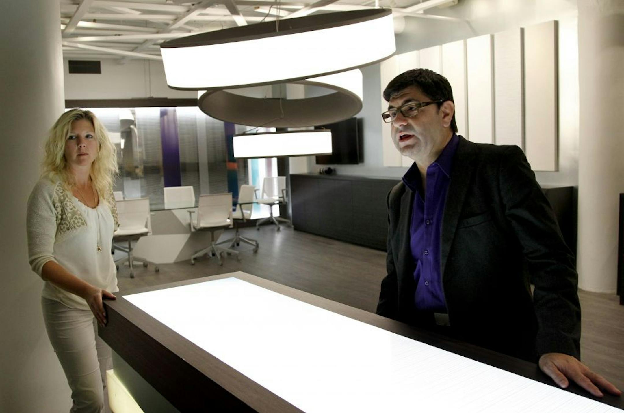 Heidi Anderson communications manager and George T. Levendusky global business development manager for 3M Architectural Markets at the new 3M showroom inside the International Market Square building in Minneapolis.