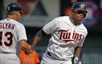 Miguel Sano(22) homers in the7th inning, scoring two runs as he rounded third base and is congratulated by coach Gene Glynn.] At the Twins vs Astros g