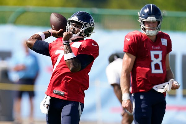 Titans second-year quarterback Malik Willis, left, has been splitting time with rookie Will Levis, right, during training camp.