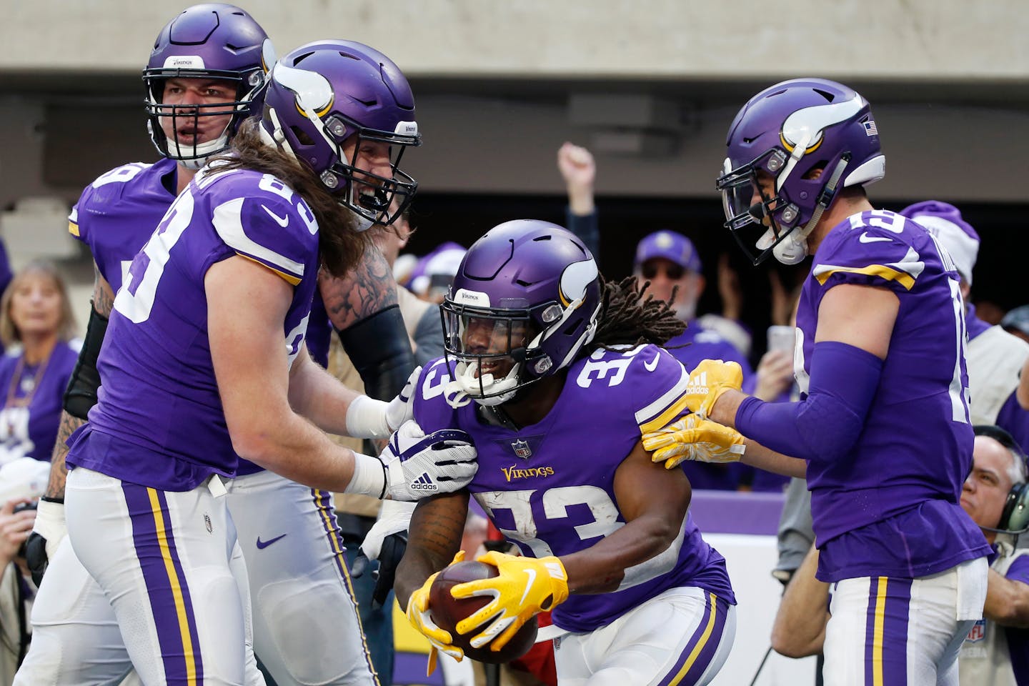 Minnesota Vikings running back Dalvin Cook (33) celebrates with teammates after scoring on a 13-yard touchdown run in the first half of an NFL football game against the Miami Dolphins, Sunday, Dec. 16, 2018, in Minneapolis. (AP Photo/Bruce Kluckhohn)