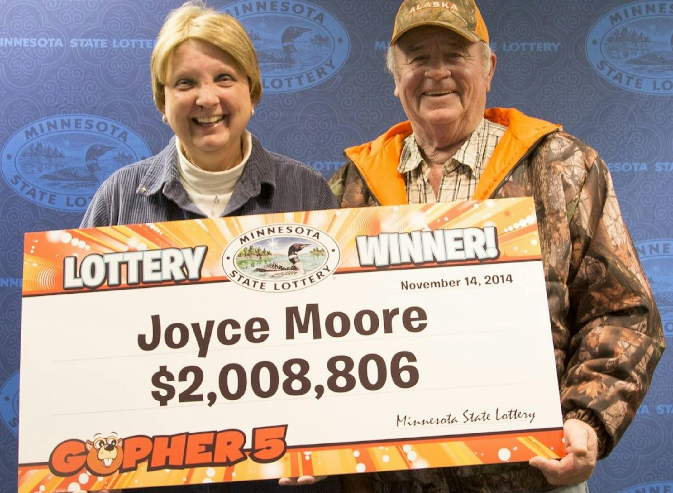 Joyce and Richard Moore, flashed their $2 million smiles.
