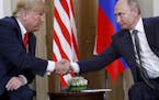 FILE In this file photo taken on Monday, July 16, 2018, U.S. President Donald Trump, left, and Russian President Vladimir Putin shake hands at the beg