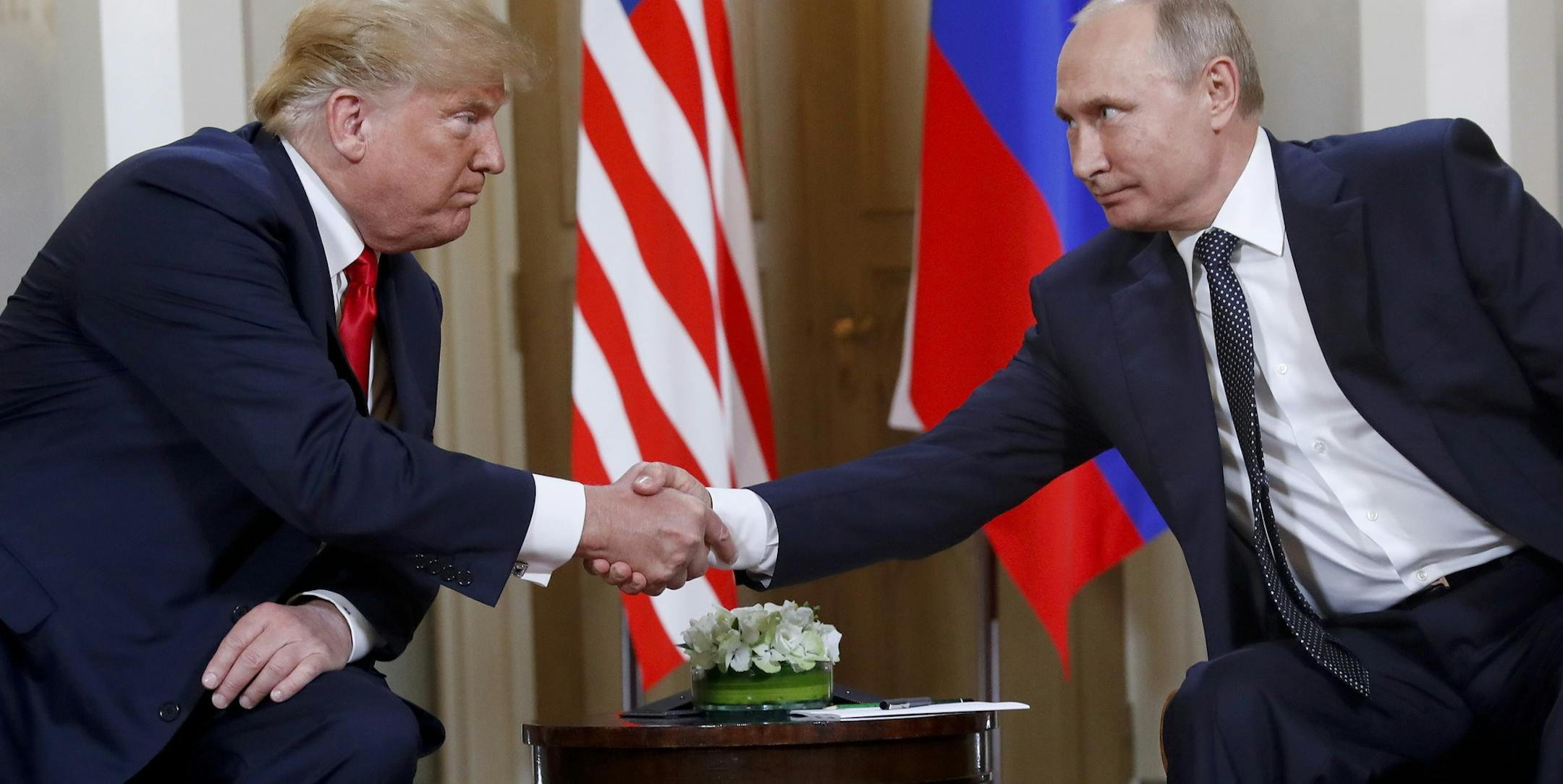 FILE In this file photo taken on Monday, July 16, 2018, U.S. President Donald Trump, left, and Russian President Vladimir Putin shake hands at the beginning of a meeting at the Presidential Palace in Helsinki, Finland. U.S. special counsel Robert Mueller has yet to release his report about Russian meddling in the 2016 U.S. presidential election, but Moscow has already rehearsed its response, dismissing Mueller's investigation as part of the U.S. political infighting. (AP Photo/Pablo Martinez Mon
