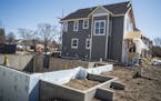Minneapolis was once again the busiest city for builders in Minnesota. Homes in this development in North Minneapolis start at $299,000] Richard Tsong