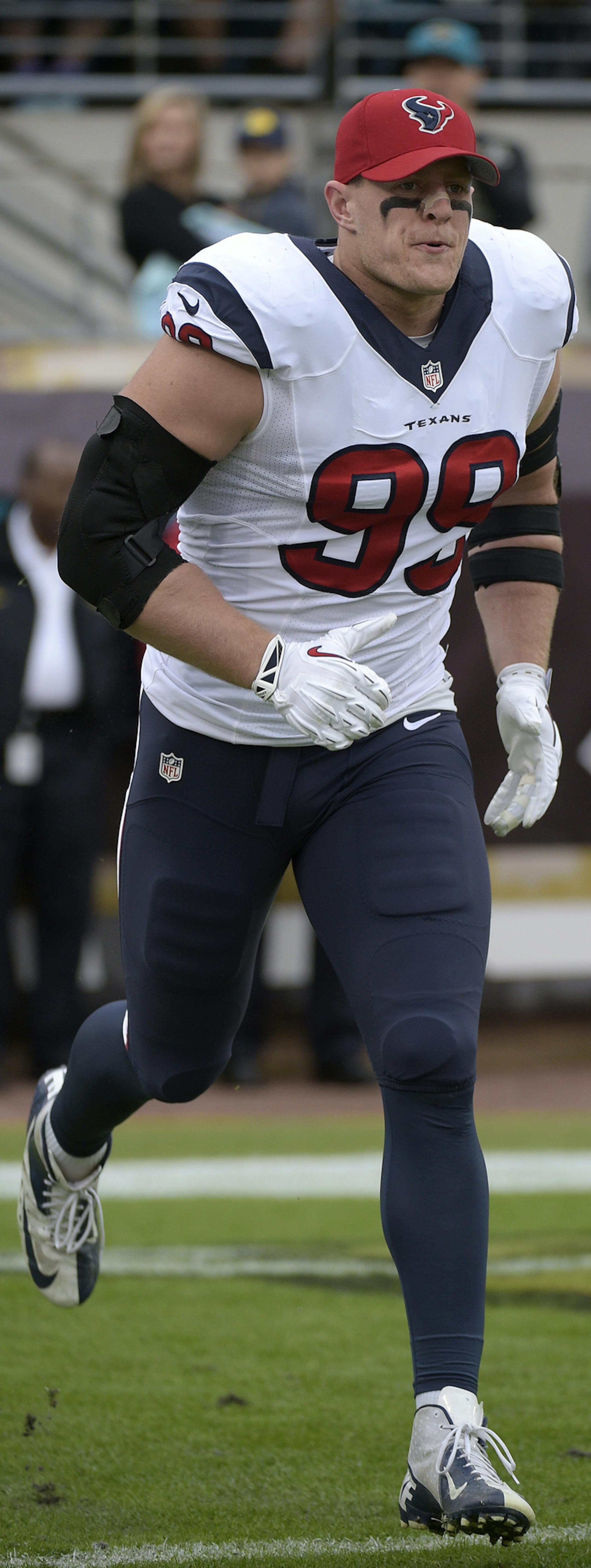 Houston Texans defensive end J.J. Watt (99) runs on the field prior to the start of an NFL football game against the Jacksonville Jaguars in Jacksonville, Fla., Sunday, Dec. 7, 2014.(AP Photo/Phelan M. Ebenhack)