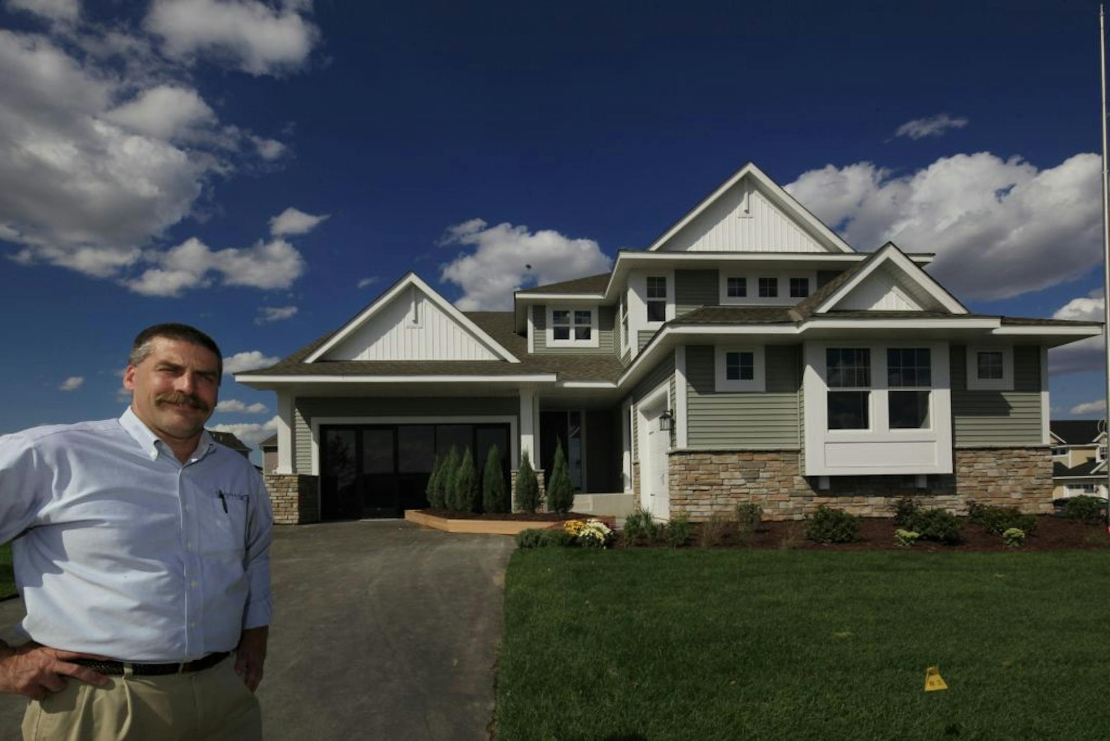 Bill Burgess of Lennar in front of its new Next Gen home in Maple Grove aimed at multigenerational families.