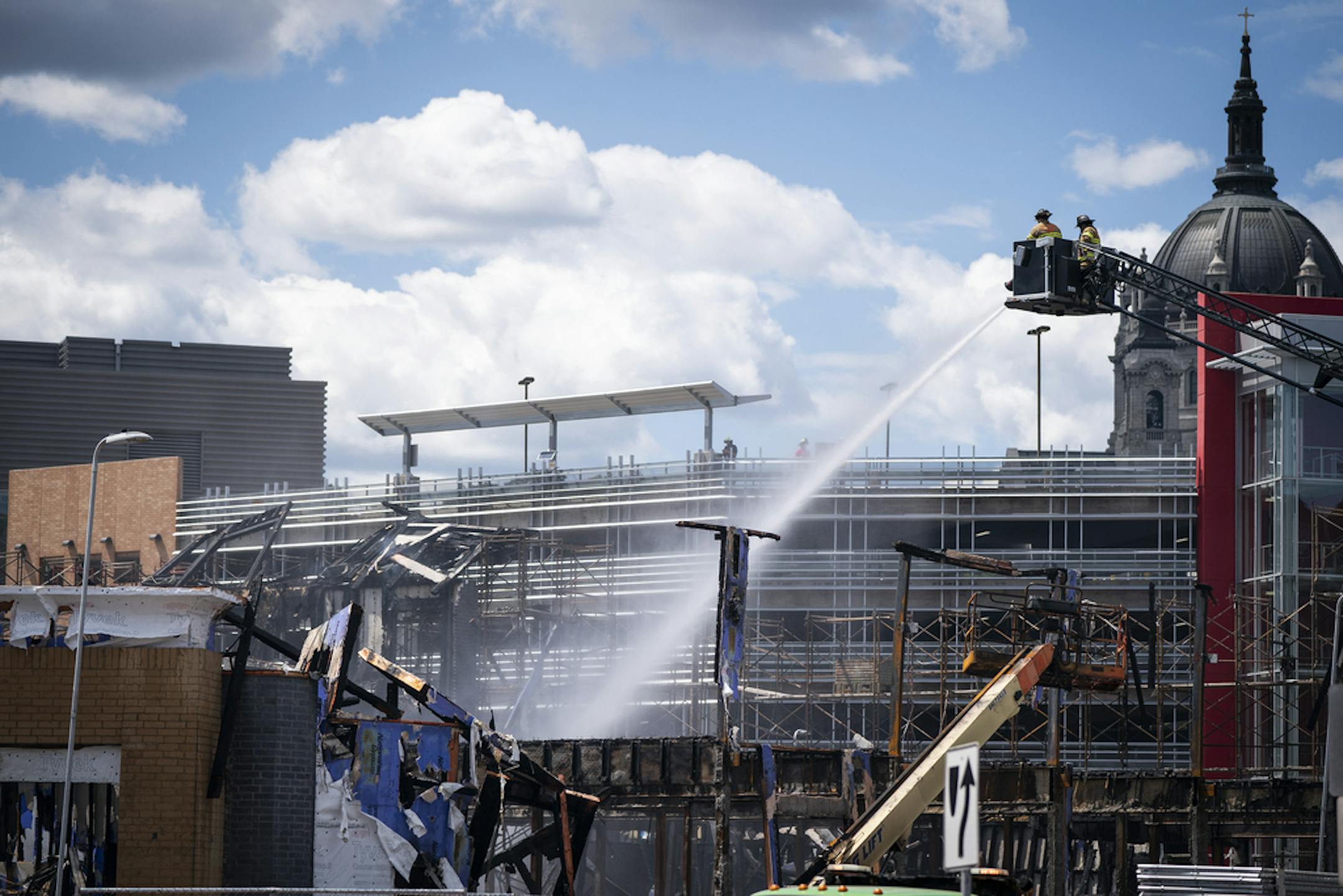St. Paul firefighters battled a fire at a construction site across from Xcel Energy Center in downtown St. Paul. ] LEILA NAVIDI • leila.navidi@startribune.com BACKGROUND INFORMATION: St. Paul firefighters battled a fire in the afternoon at a construction project across from the Xcel Energy Center on Tuesday, August 4, 2020. A Courtyard by Marriott hotel and apartment complex under construction across the street from Xcel Energy Center in downtown St. Paul caught fire early Tuesday morning, resul