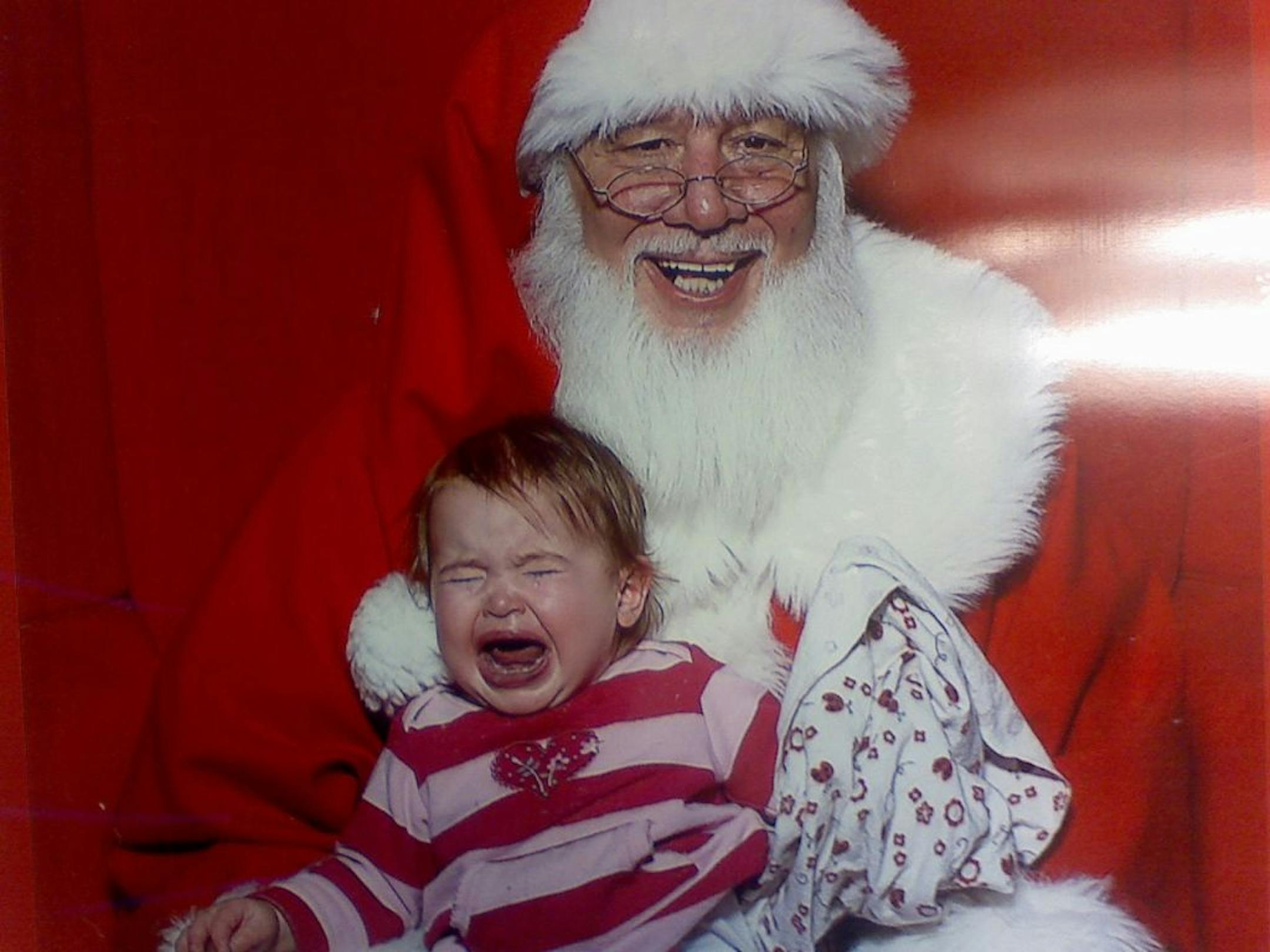 Riley Grace Bevan, pictured at 15 months, screamed on Santa's lap.