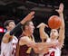 Wisconsin's Duje Dukan, left, and Bronson Koenig trap Minnesota's Joey King during the first half of an NCAA college basketball game Thursday, Feb. 13