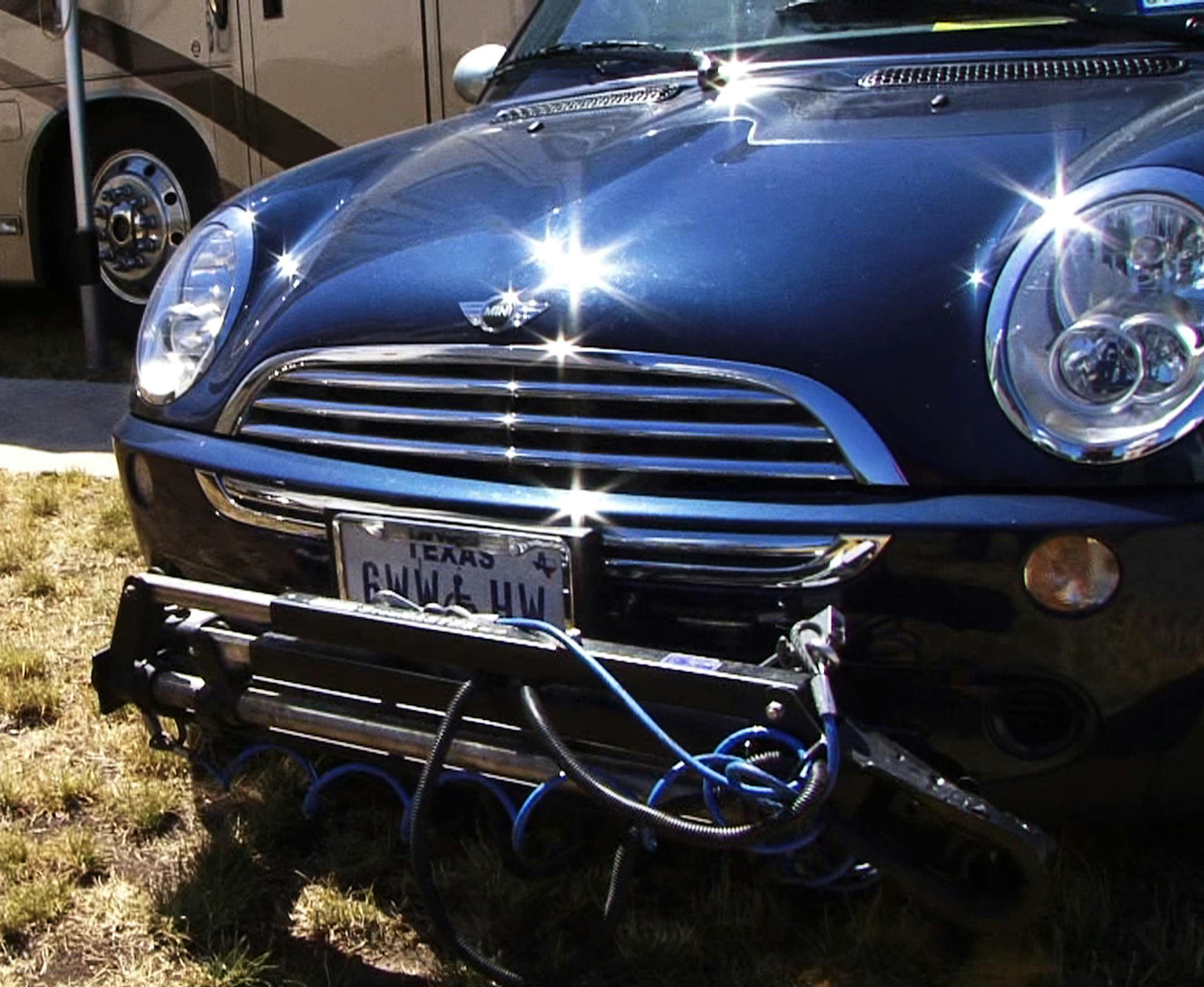 This Mini-Cooper has a special hitch which allows it to be hooked up to the much larger RV.