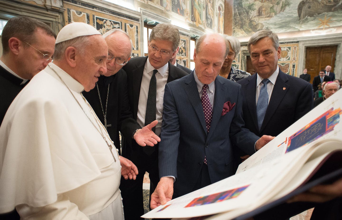 Pope Francis meets with delegation from St. John's University in Collegeville to receive the final volume of a limited edition of the university's famous Saint John's Bible. Pictured with Pope Francis (left to right) Abbot John Klassen, OSB, Saint John&#xed;s Abbey; Michael Hemesath, president of Saint John&#xed;s University; Donald Jackson, artistic director of The Saint John&#xed;s Bible, and Katharine and Dan Whalen, former board chair of St. John's.