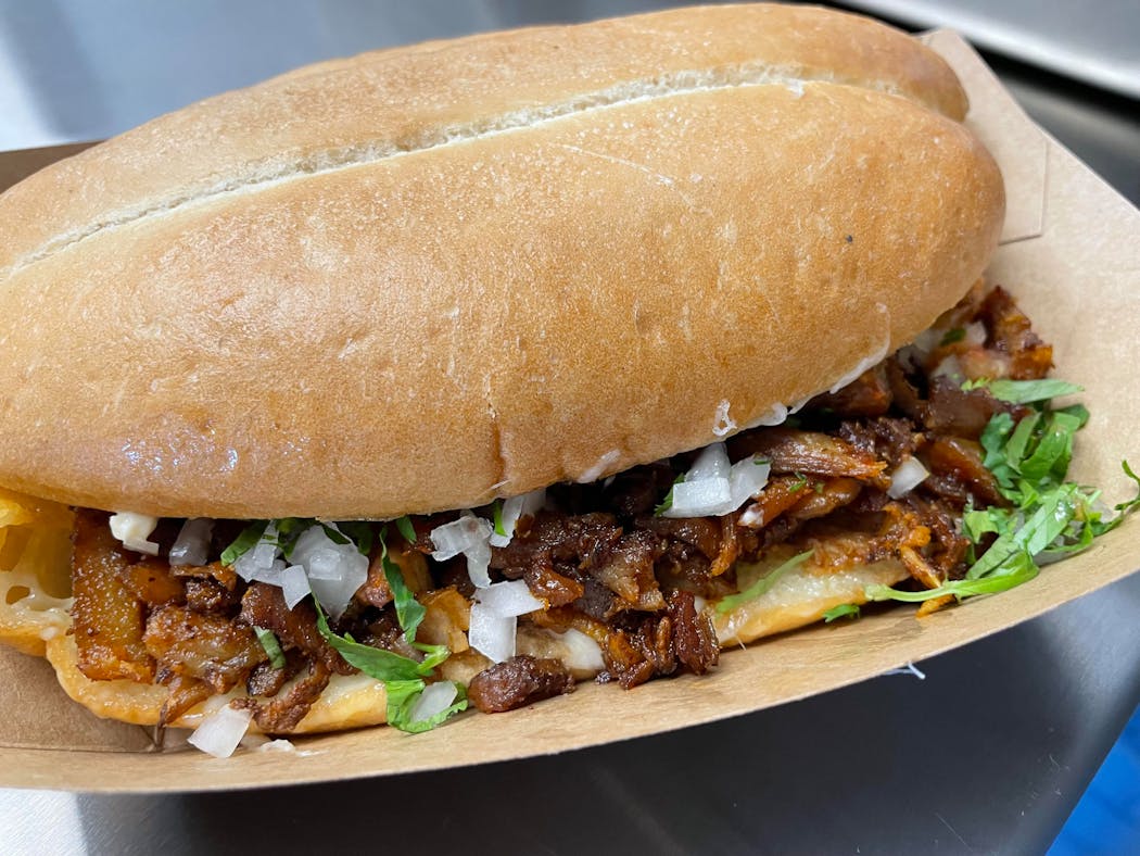 There’s a new torta on West 7th, served with spit-roasted al pastor.