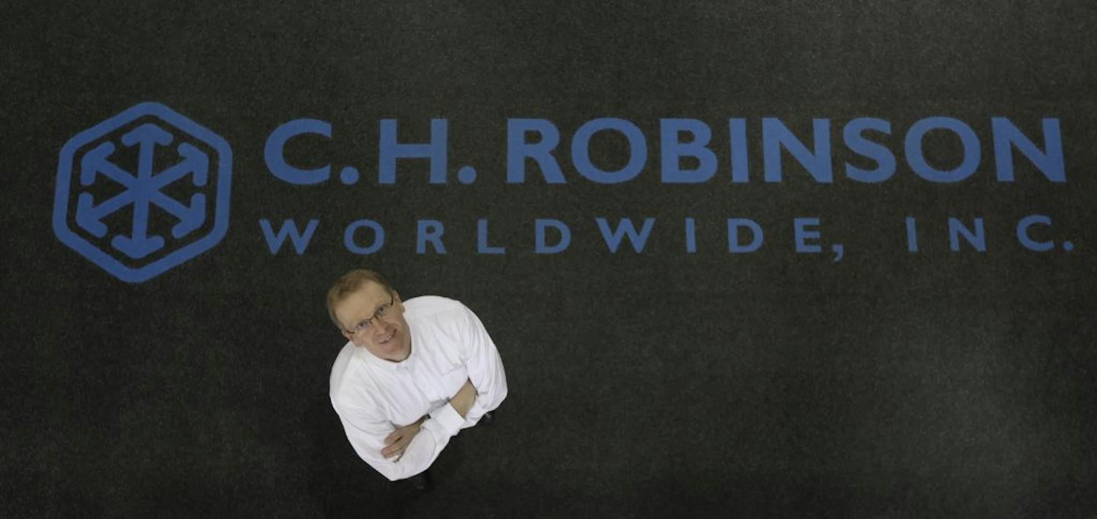 John Wiehoff , the CEO of C.H. Robinson, stood in the lobby of their headquarters in Eden Prairie Min., Wednesday, February 22, 2012. C.H. Robinson is a $10 billion a year international freight logistics company that matches companies that ship freight with available trucks, railroad cars, ships and airplanes