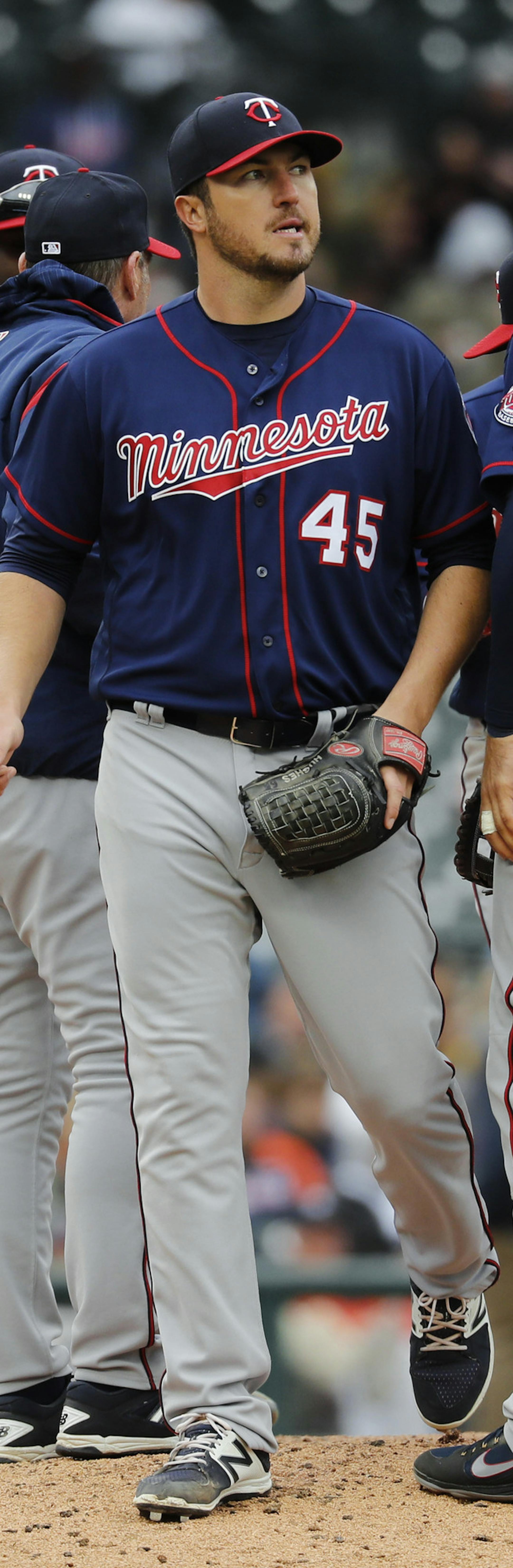 Minnesota Twins pitcher Phil Hughes (45) is pulled against the Detroit Tigers in the sixth inning of a baseball game in Detroit, Thursday, April 13, 2017. (AP Photo/Paul Sancya)