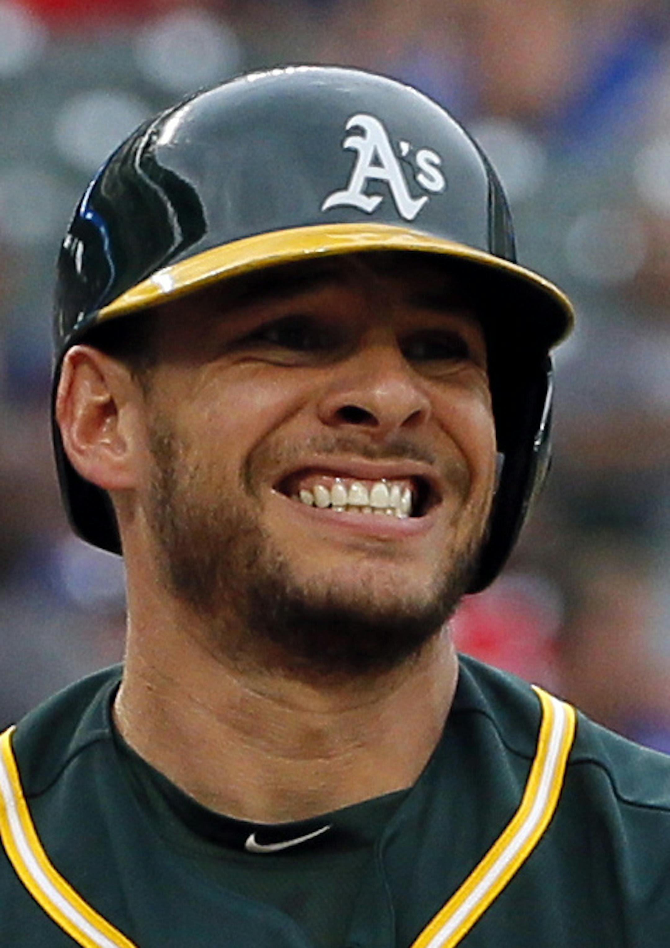 Oakland Athletics' Danny Valencia reacts to a strike called against him during a baseball game against the Texas Rangers on Monday, Aug. 15, 2016, in Arlington, Texas. (AP Photo/Tony Gutierrez)
