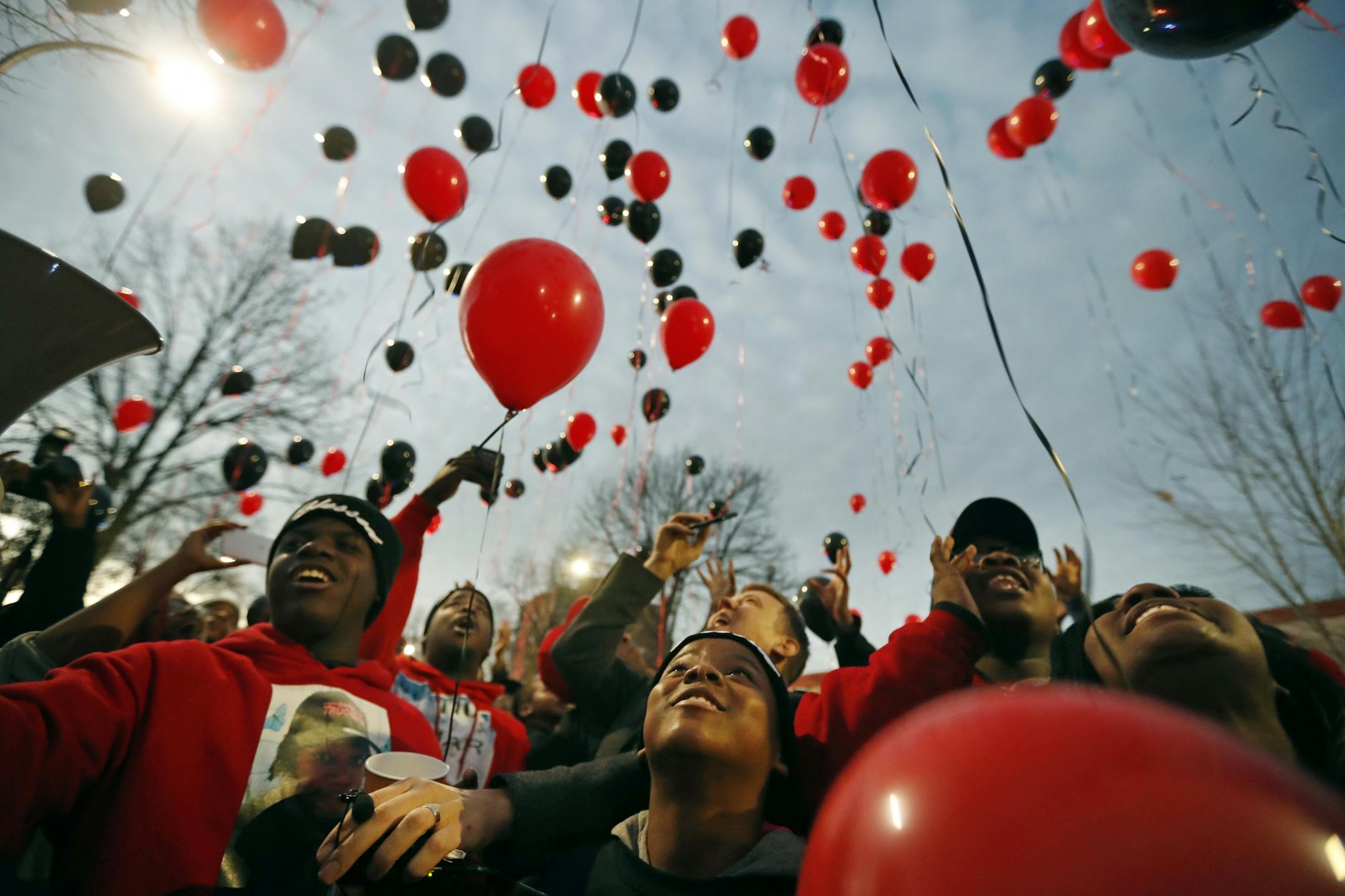 Family members, friends and community activists released balloons near the spot where Jamar Clark was killed in a confrontation with city police last fall to commemorate his death Tuesday October 15, 2016 in Minneapolis, MN.