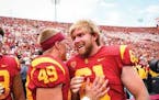 Jake Olson, the blind former long snapper for the University of Southern California football team, brought his inspirational story to St. Thomas Acade
