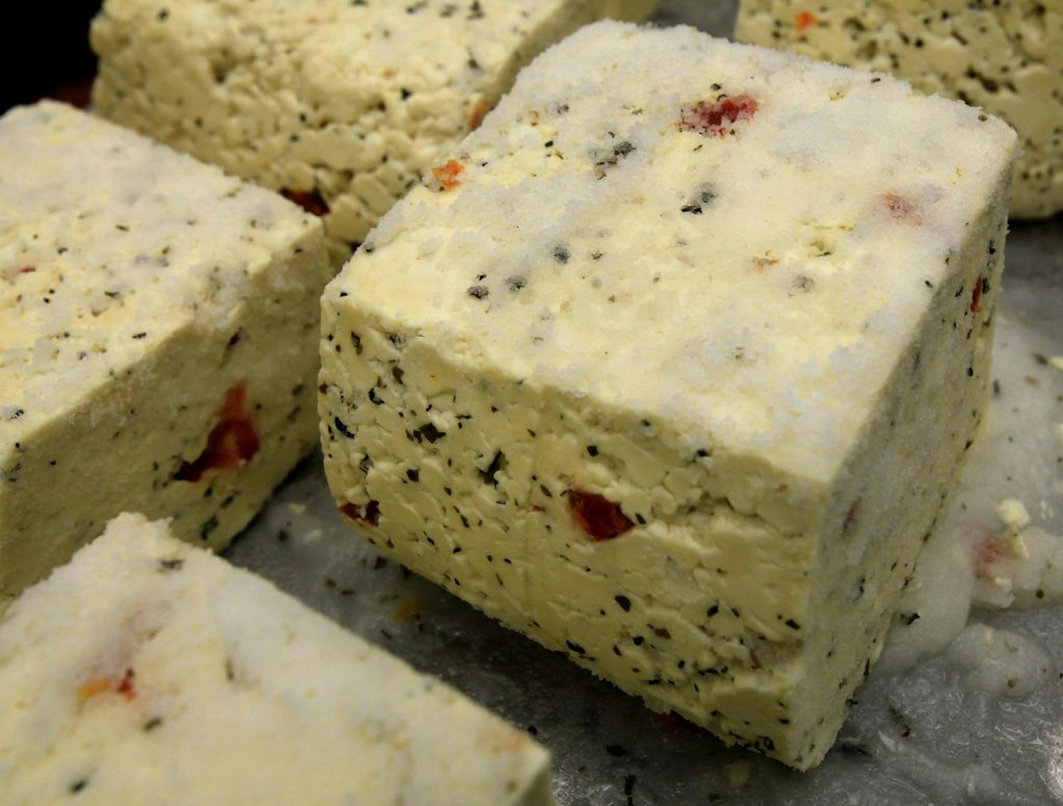 This cheese will be put in a bucket, covered in brine and then refridgerated for a week. After it is finished, the cheese will be sold on the U of M campus. Tonya Schoenfuss (right) is a food science professor at the U of M who specializes in dairy products. Her primary work right now is developing low-sodium cheese. It's a big dairy food industry challenge. Cheese is a high salt product and salt is needed for both flavor and function. Yet so far, the market for low sodium cheese is not well dev