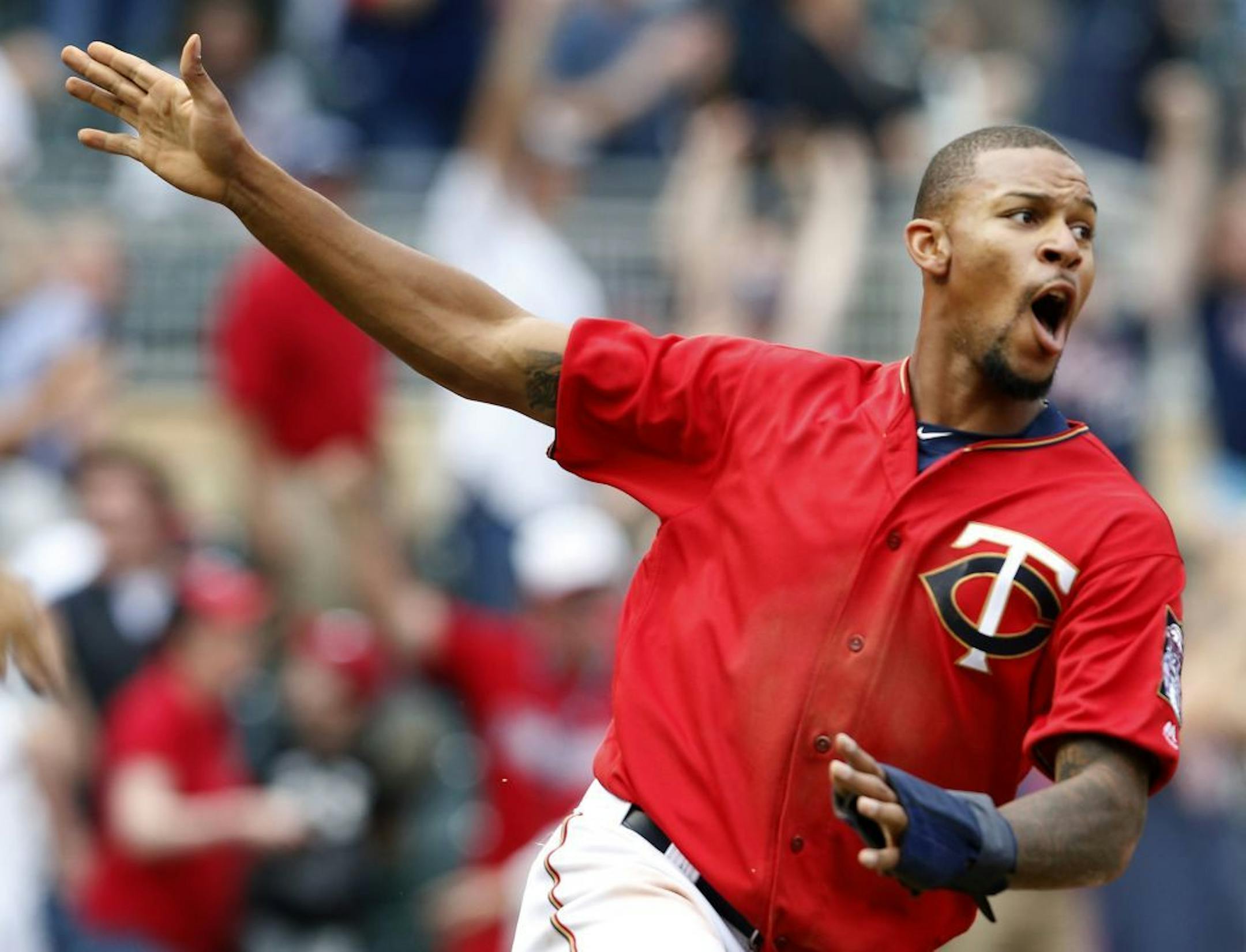 Byron Buxton celebrated after scoring the game-winning run on a hit by Oswaldo Arcia in the twelfth inning. Minnesota beat Los Angeles by a final score of 3-2.