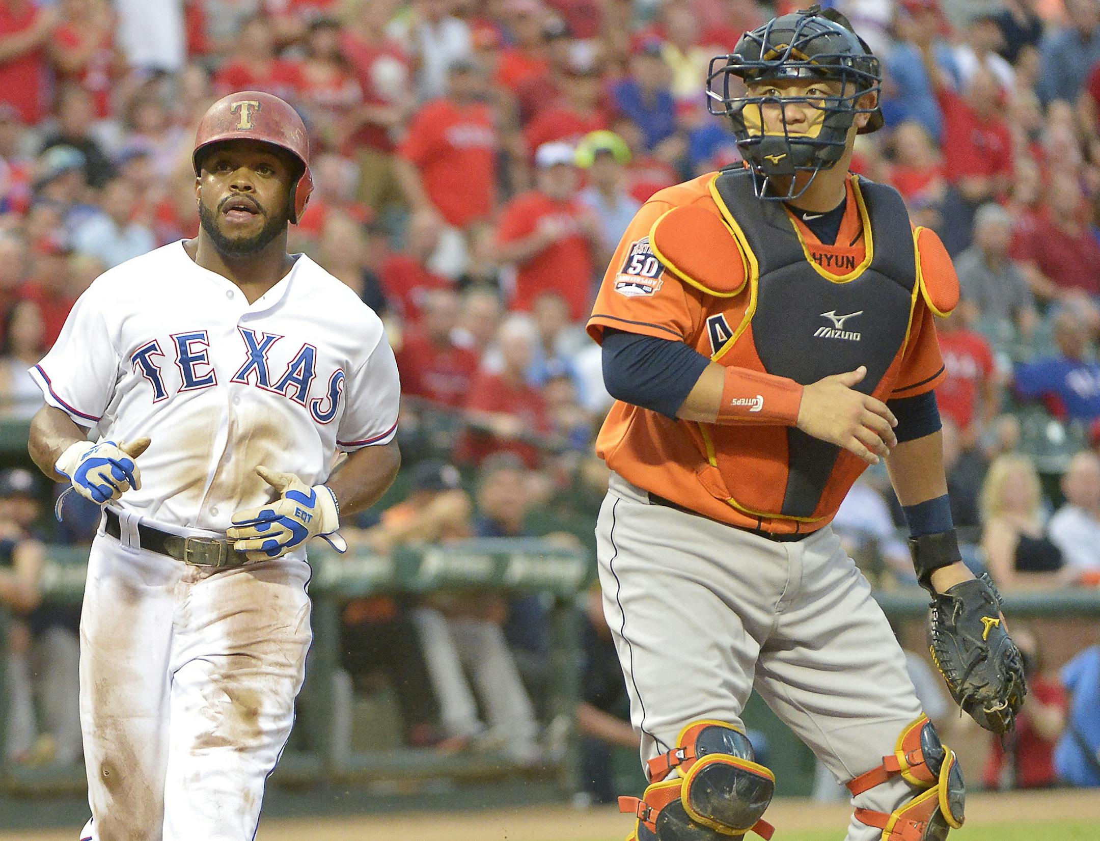 The Texas Rangers' Delino DeShields scores a run on a Prince Fielder double during the first inning against the Houston Astros at Globe Life Park in Arlington, Texas, on Tuesday, Sept. 15, 2015. (Max Faulkner/Fort Worth Star-Telegram/TNS) ORG XMIT: 1173839