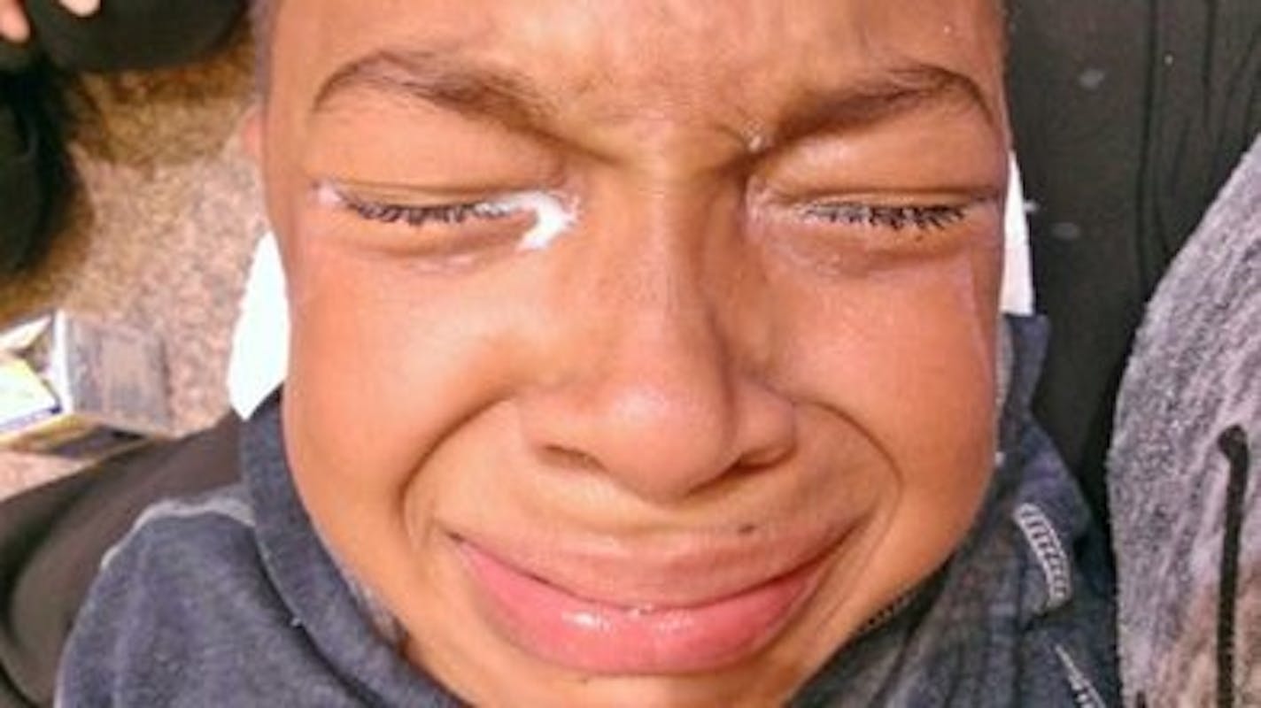 Susan Montgomery took this photo of her son, Taye, whose eyes were treated with milk to counteract a chemical irritant she said was sprayed by a police officer.