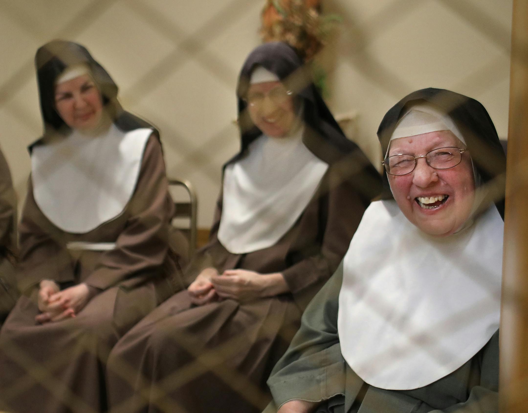 Poor Clare nuns of St. Clare's Monastery nuns met with journalists in the monastery's parlor, the one room where outsiders have partial access to the nuns in a room divided by a metal fencing with a folding wooden divider and seen Thursday, April 16, 2020, in Sauk Rapids, MN. Pictured are Mother Mary Barbara, right to left, Sister Marie Elizabeth and Sister Mary Matthew.