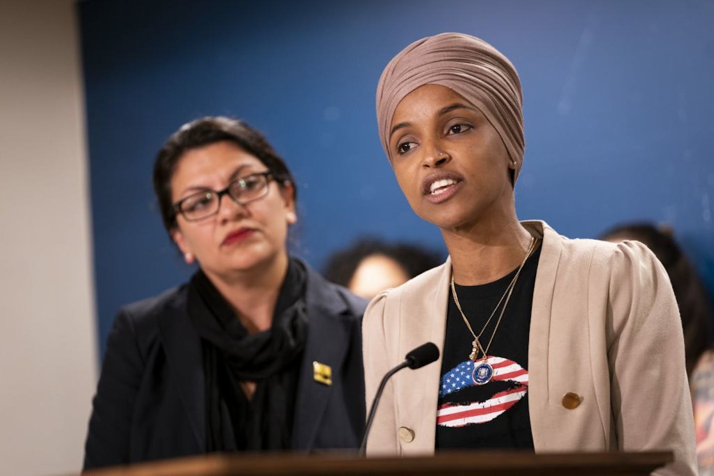 Rep. Ilhan Omar, with Rep. Rashida Tlaib at her side, spoke at a press conference at the State Capitol in St. Paul, Minn., on Monday, August 19, 2019.