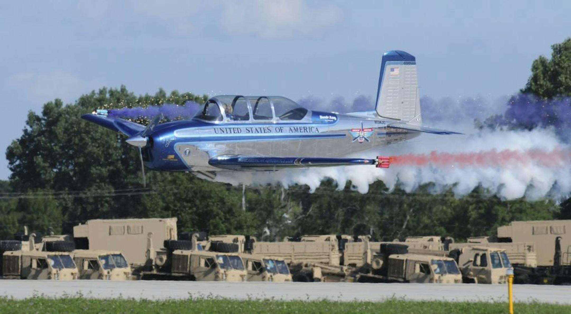 At full throttle, Julie and her T-34 thrill spectators by skimming over the ground at 8 feet. (Photo taken at Oshkosh Air Show.) Credit for all photos: Susan Wood Photography