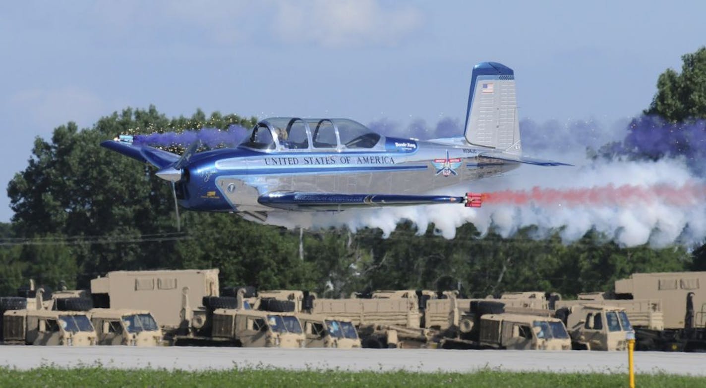 At full throttle, Julie and her T-34 thrill spectators by skimming over the ground at 8 feet. (Photo taken at Oshkosh Air Show.) Credit for all photos: Susan Wood Photography