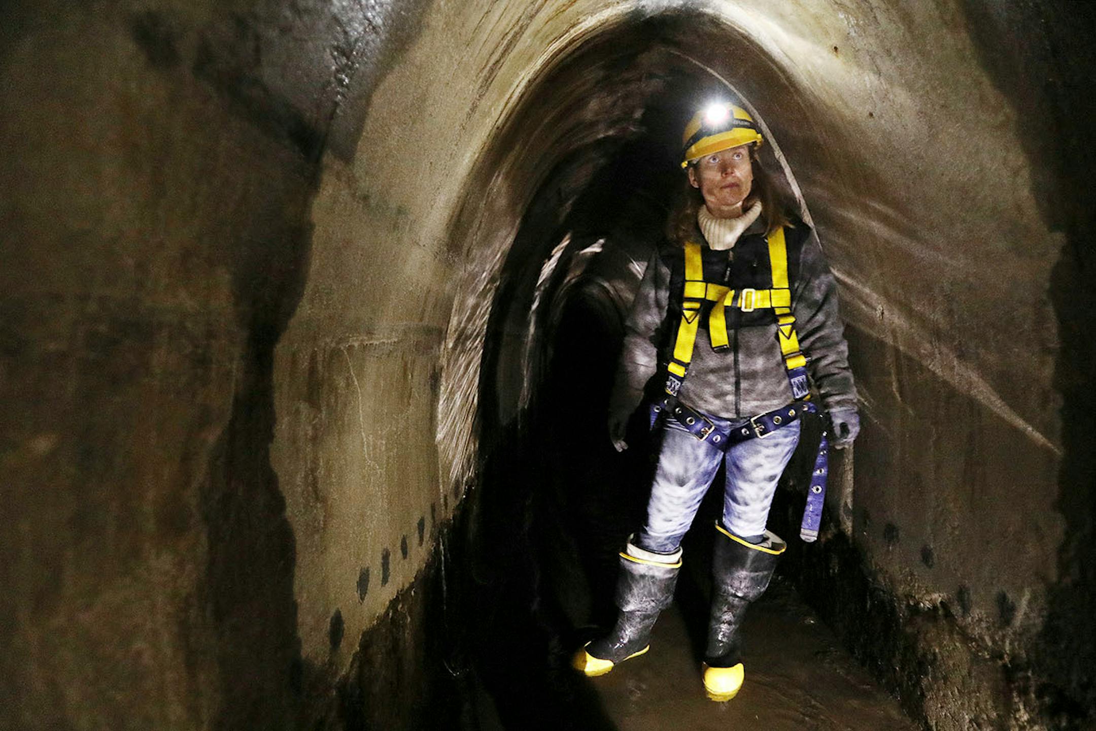 Katrina Kessler, director of Surface Water and Sewers for the Minneapolis Public Works Department, stood in the city's storm sewers in the northeast during a tour underground.