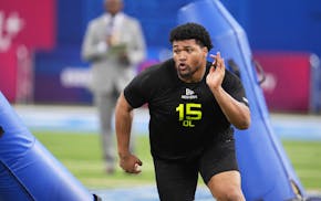 Oregon defensive lineman Derrick Harmon, a popular option for the Vikings in mock drafts, runs a drill at the NFL scouting combine in Indianapolis in