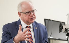 Gov. Tim Walz on Thursday signed a bill regulating school resource officer programs and allowing them, once again, to place students in the prone posi