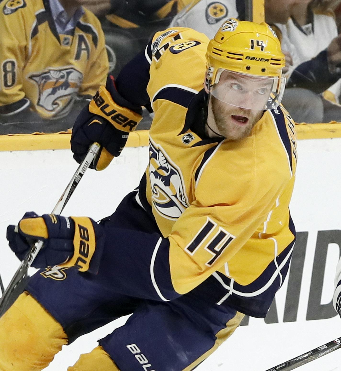 Nashville Predators defenseman Mattias Ekholm (14), of Sweden, and Washington Capitals left wing Alex Ovechkin (8), of Russia, chase the puck during the first period of an NHL hockey game Saturday, Feb. 25, 2017, in Nashville, Tenn. (AP Photo/Mark Humphrey) ORG XMIT: TNMH104