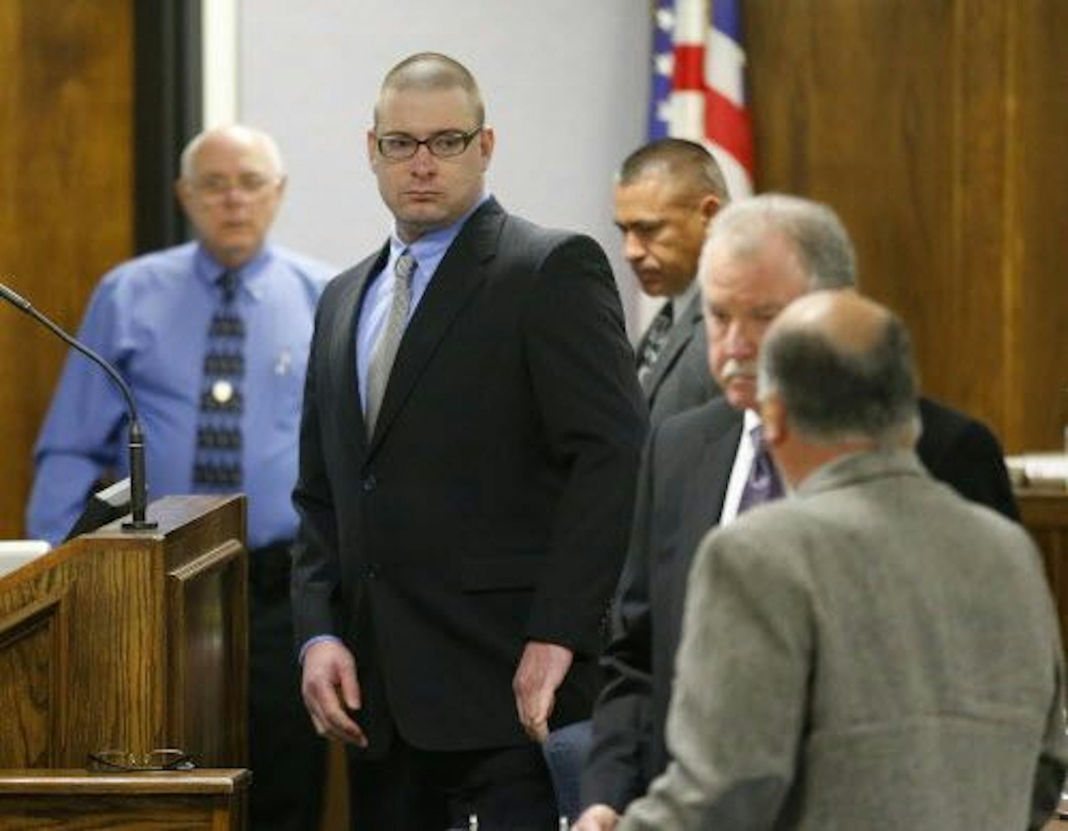 Former Marine Cpl. Eddie Ray Routh, center, appears in court on the opening day of his capital murder trial.