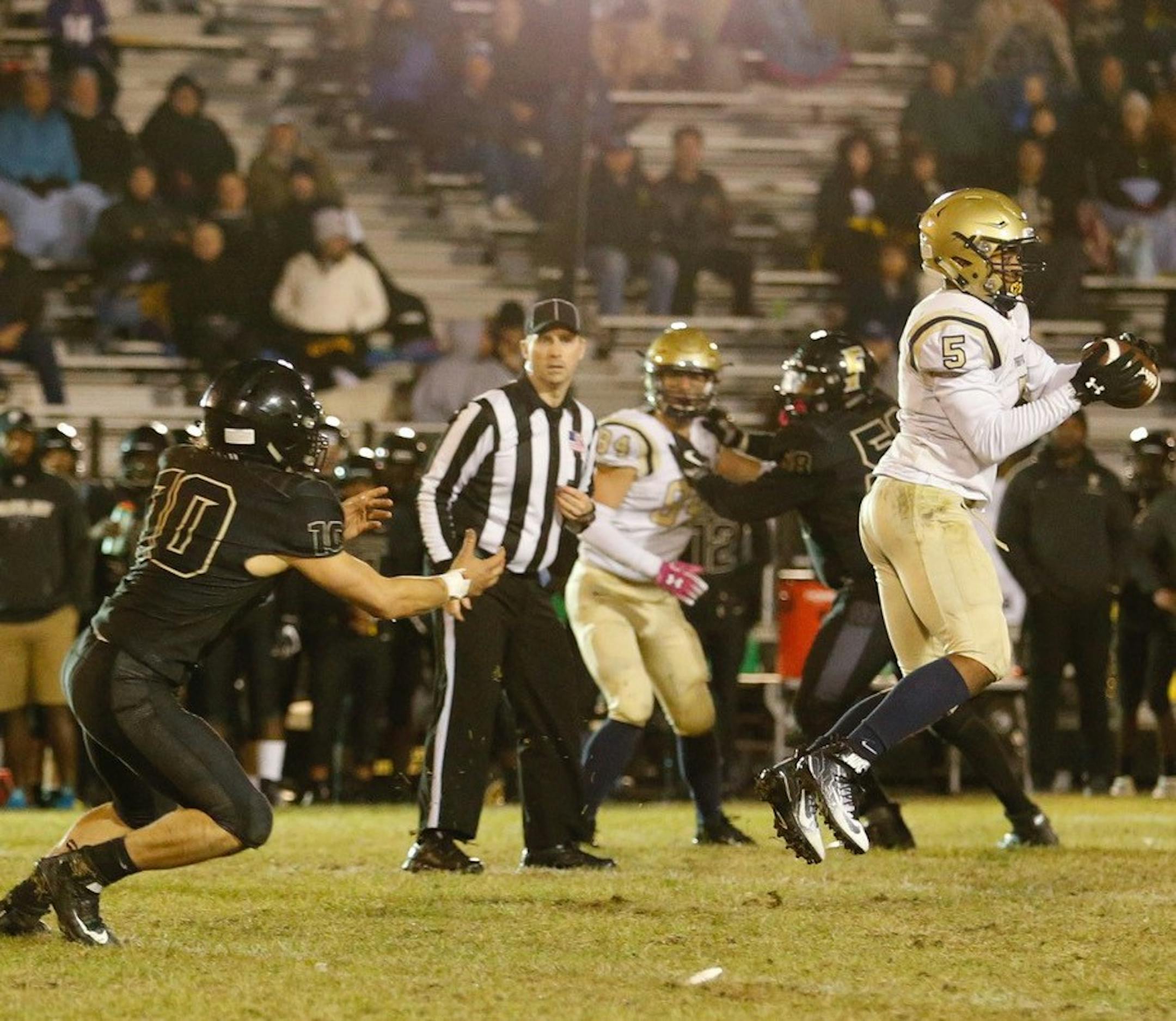 Providence Academy linebacker Jaden Morten intercepts a pass in front of Fridley's Cooper Severson. Morten would return the interception for a touchdown. Photo by Jeff Lawler, SportsEngine