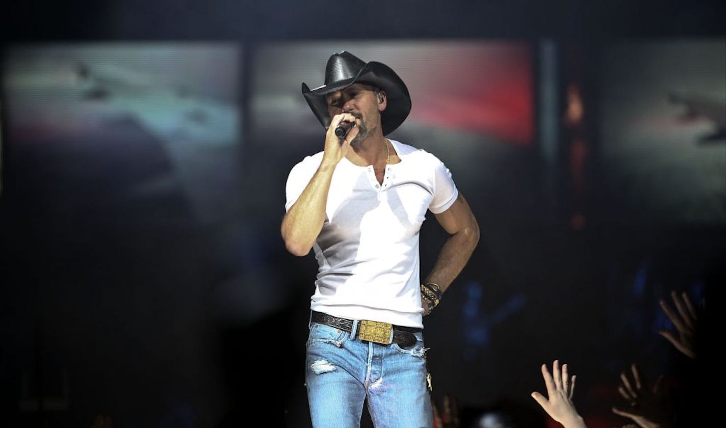 Tim McGraw plays Target Field with Kenny Chesney on Sunday.