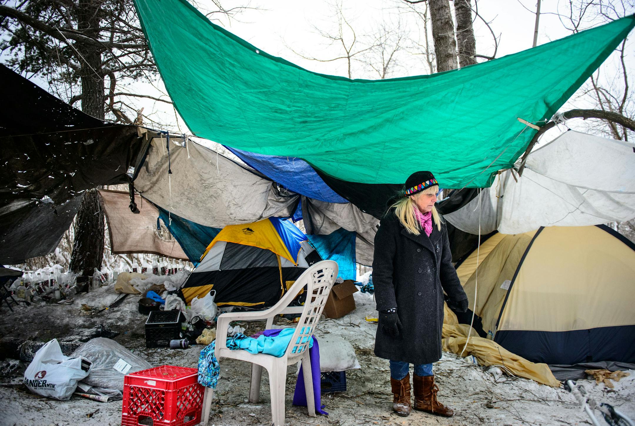 With temperatures in the single digits, Deb Holman, street outreach worker for CHUM left blankets and new gloves at a homeless camp on a bluff overlooking Duluth harbor Friday, January 3, 2014 ] GLEN STUBBE * gstubbe@startribune.com EDS, CHUM is Churches United in Ministry