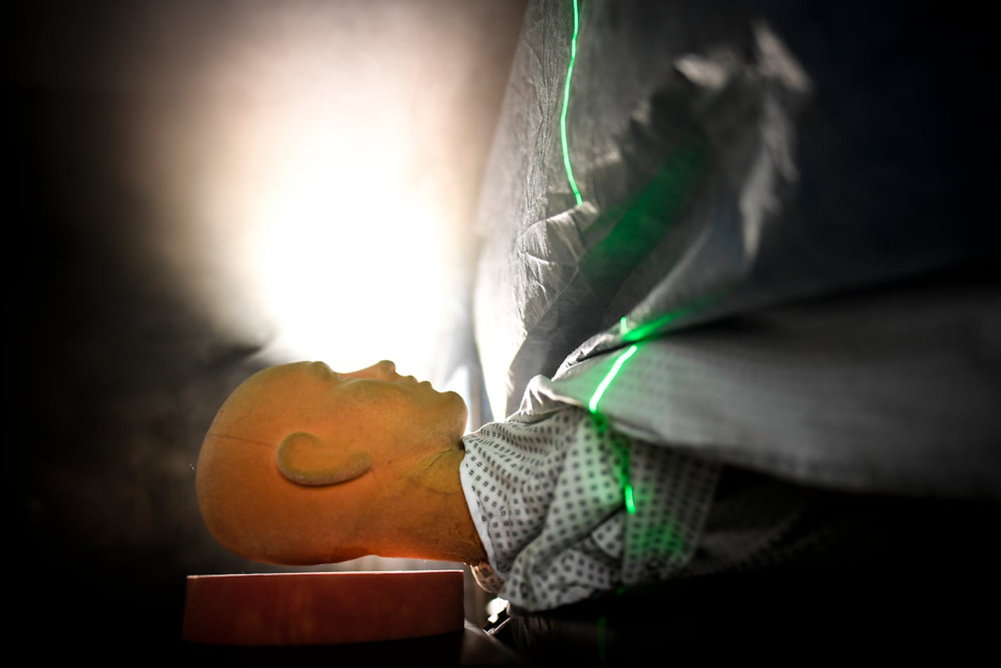 Fog from a fog machine rose from under the sheets of a mock operating table during a demonstration Friday using the Bair Hugger medical warming device.