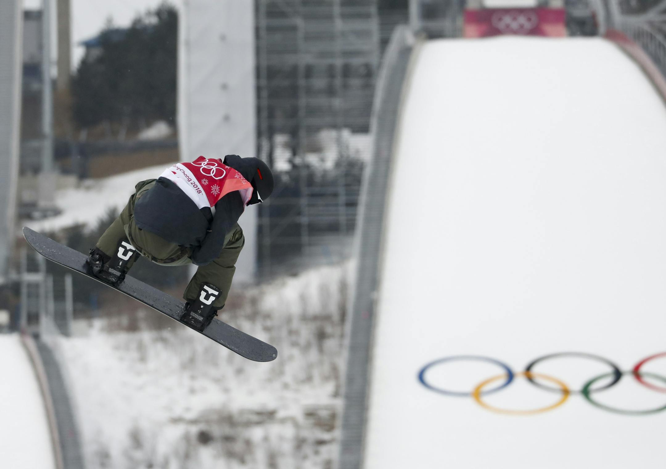 Jonas Boesiger, of Switzerland, jumps during the men's Big Air snowboard competition at the 2018 Winter Olympics in Pyeongchang, South Korea, Saturday, Feb. 24, 2018. (AP Photo/Matthias Schrader)
