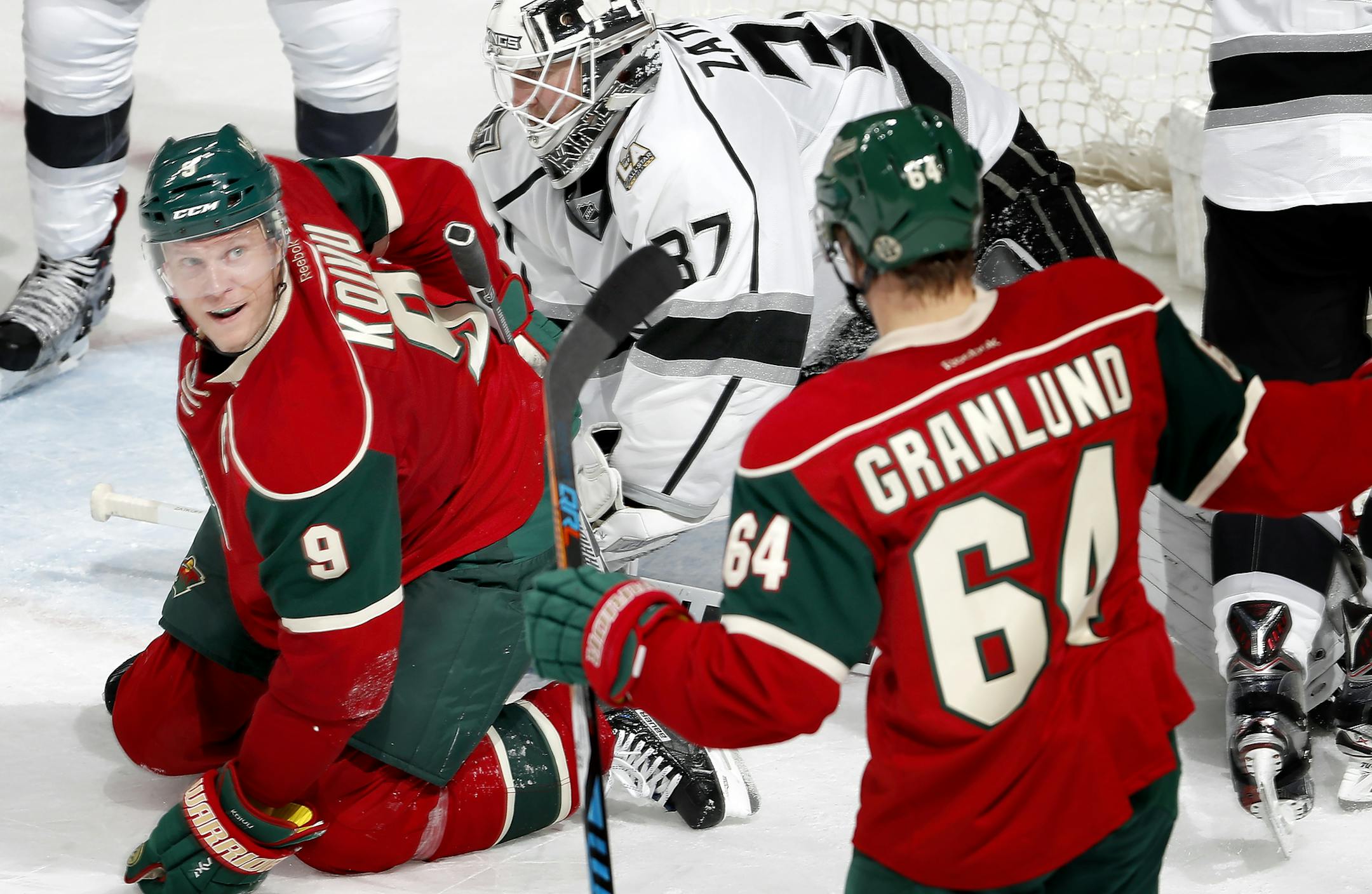 Mikko Koivu (9) and Mikael Granlund (64) celebrated after Koivu shot the puck past Kings goalie Jeff Zatkoff for a goal in the second period.
