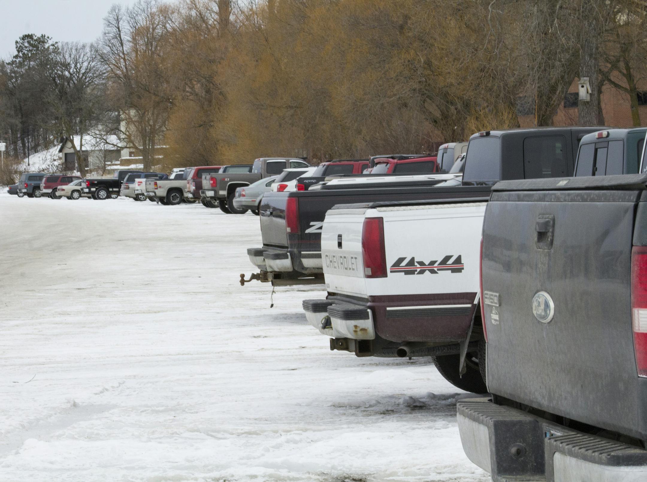 Commuters at Bemidji State University park their vehicles on frozen Lake Bemidji in the winter for shorter walks to class.